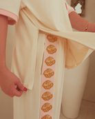 Beige oversized shirt with breastfeeding zippers on the side-seams. 