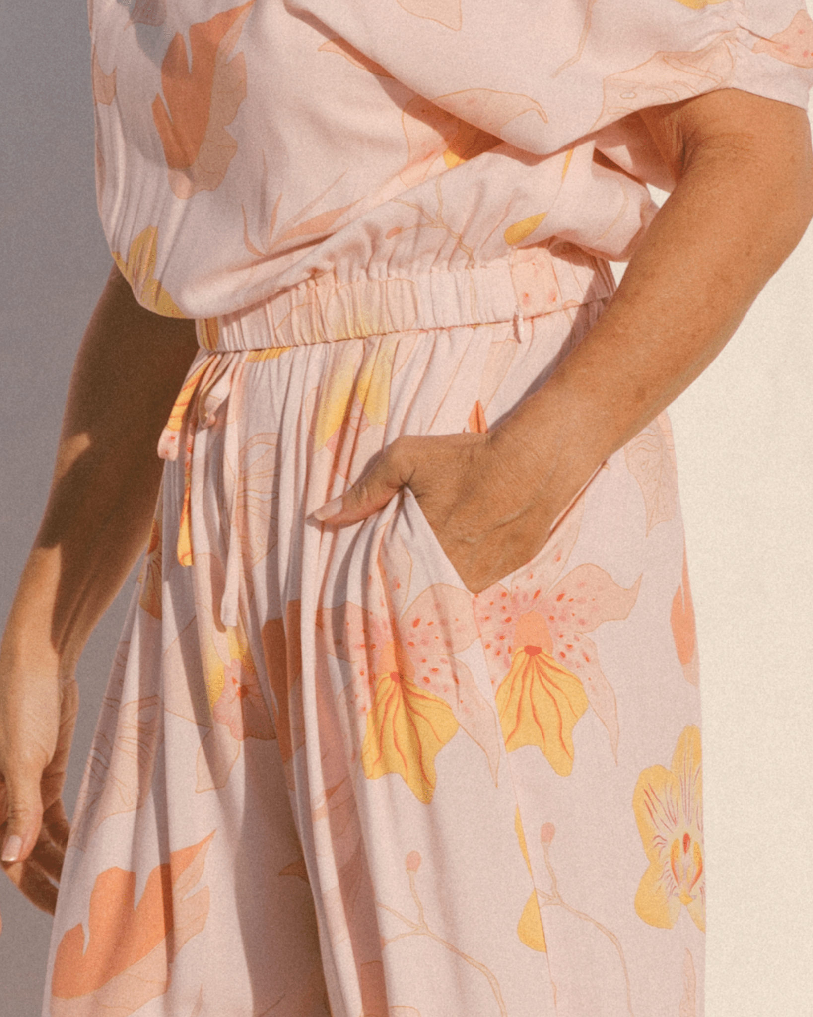 Close-up of elastic waistband of high-waisted spring pants. 